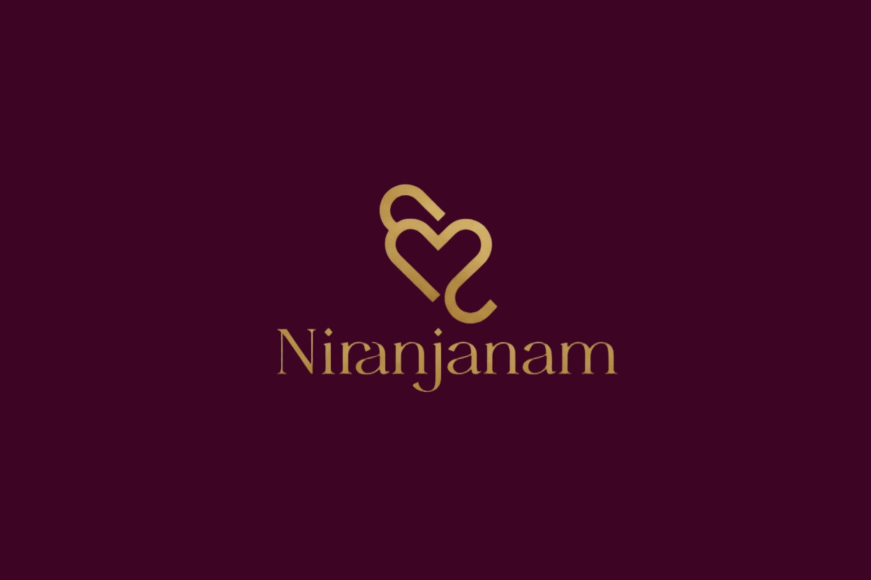 Logo of Niranjanam on a purple background with decorative elements